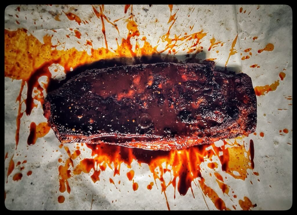 BBQ Spareribs 7 Stunden im Eichenrauch gegart – Spezialität vom Smoker im Restaurant Drachenburg Marktbreit.